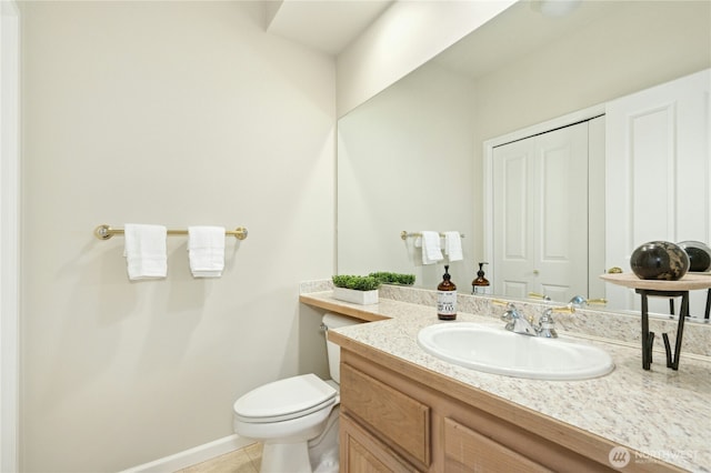9821 NE Riverbend Dr Unit C102, Bothell, WA 98011 - bathroom featuring vanity, toilet, baseboards, and tile patterned flooring
