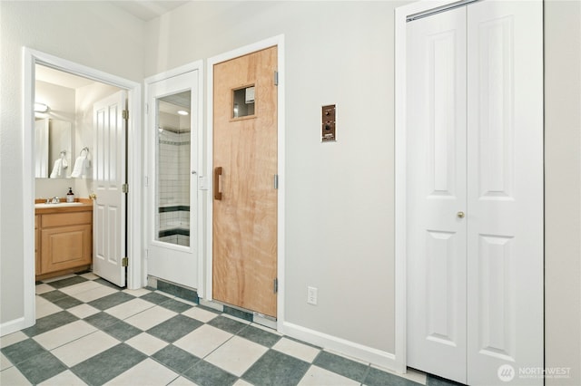 9821 NE Riverbend Dr Unit C102, Bothell, WA 98011 - full bathroom featuring a closet, vanity, baseboards, and a shower