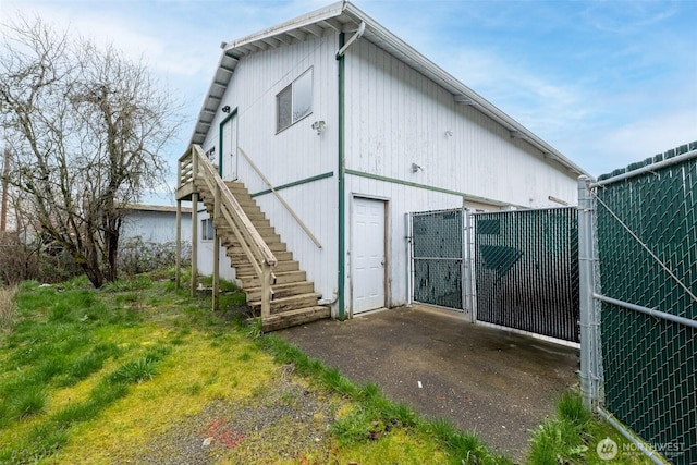 228 S 3rd St, Shelton, WA 98584 - rear view of house featuring a gate, stairway, and fence