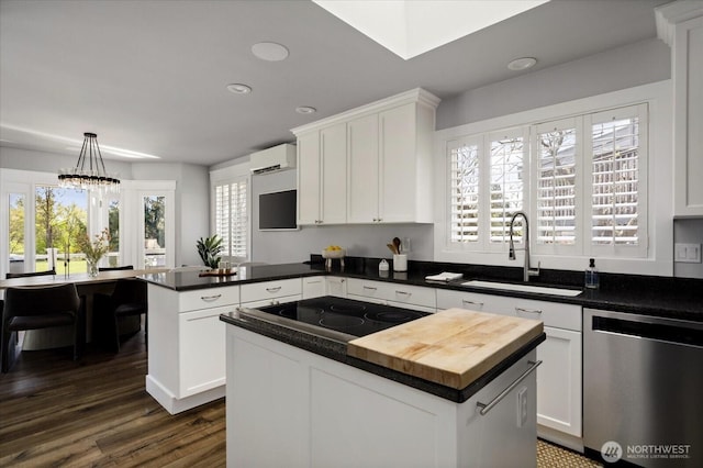 kitchen featuring a sink, a wall mounted AC, dishwasher, a peninsula, and dark wood-type flooring