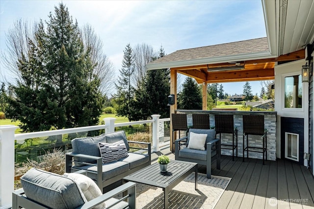 wooden deck featuring outdoor dry bar and outdoor lounge area