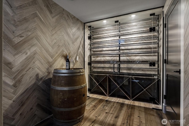 wine cellar featuring wood finished floors and recessed lighting