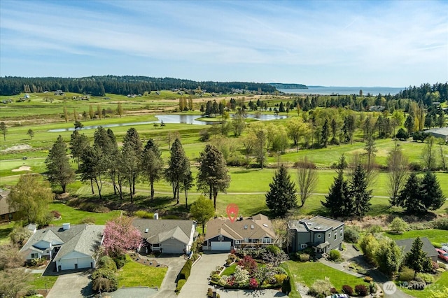 drone / aerial view featuring a residential view and a water view