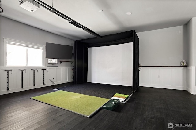 recreation room featuring visible vents, wood finished floors, and golf simulator