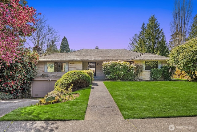 5429 NE Windermere Rd, Seattle, WA 98105 - ranch-style home featuring a front lawn, aphalt driveway, stone siding, a chimney, and an attached garage