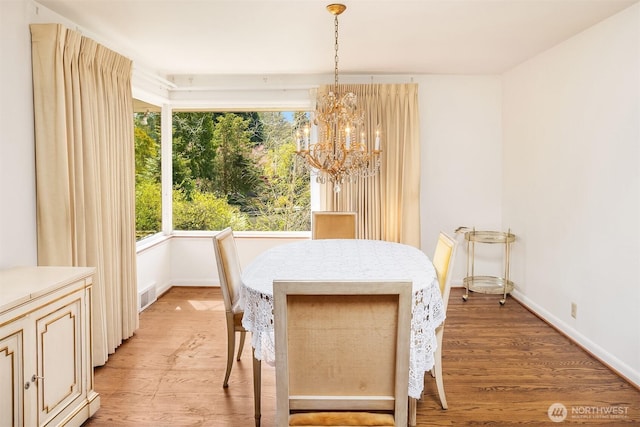 5429 NE Windermere Rd, Seattle, WA 98105 - dining area featuring light wood-style floors, plenty of natural light, visible vents, and a notable chandelier