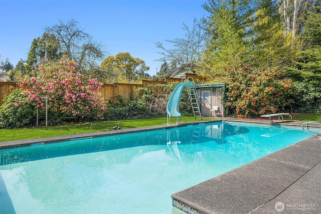 5429 NE Windermere Rd, Seattle, WA 98105 - view of swimming pool with a fenced backyard, a fenced in pool, a water slide, and a diving board