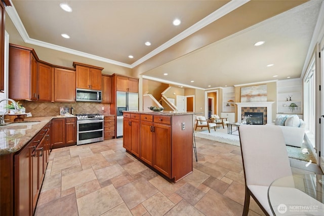 162 Costello Pl, Walla Walla, WA 99362 - kitchen featuring brown cabinets, appliances with stainless steel finishes, recessed lighting, and a sink