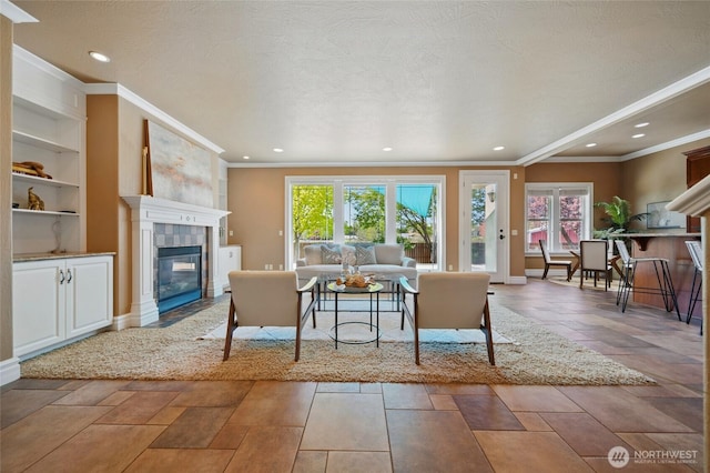 162 Costello Pl, Walla Walla, WA 99362 - living area with built in features, a fireplace, ornamental molding, and a healthy amount of sunlight