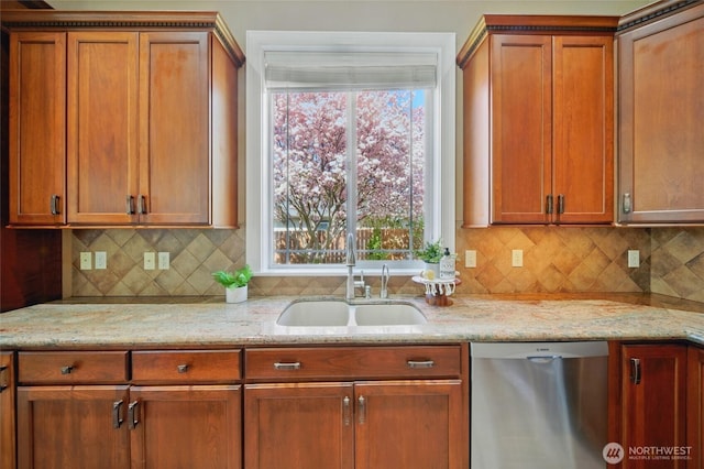 162 Costello Pl, Walla Walla, WA 99362 - kitchen with stainless steel dishwasher, tasteful backsplash, light stone countertops, and a sink
