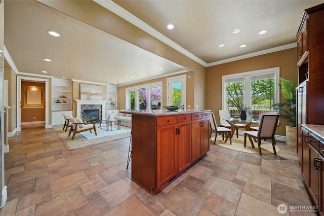 162 Costello Pl, Walla Walla, WA 99362 - kitchen featuring recessed lighting, a tile fireplace, light stone countertops, baseboards, and built in shelves