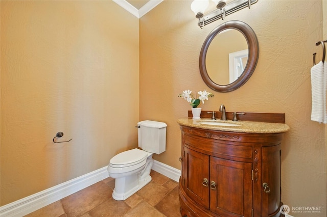 162 Costello Pl, Walla Walla, WA 99362 - bathroom featuring toilet, ornamental molding, vanity, and baseboards