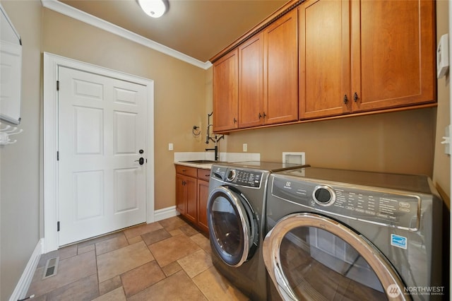 162 Costello Pl, Walla Walla, WA 99362 - laundry area featuring crown molding, separate washer and dryer, cabinet space, baseboards, and stone finish floor