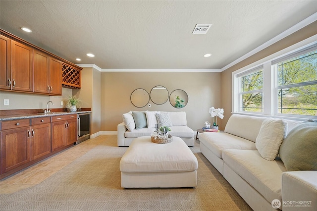 162 Costello Pl, Walla Walla, WA 99362 - living room featuring recessed lighting, visible vents, ornamental molding, and indoor wet bar