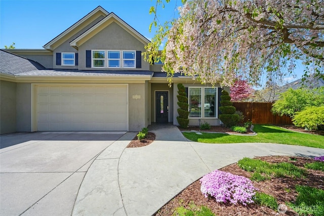 162 Costello Pl, Walla Walla, WA 99362 - traditional home with an attached garage, concrete driveway, stucco siding, and fence