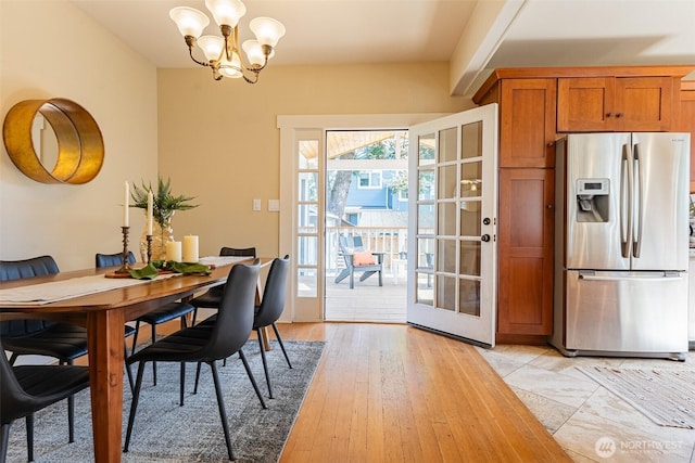 dining space featuring a chandelier