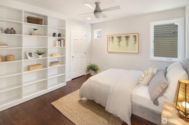 bedroom with dark wood-type flooring and ceiling fan
