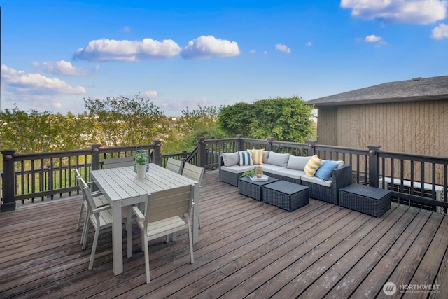 wooden deck with an outdoor hangout area and outdoor dining area