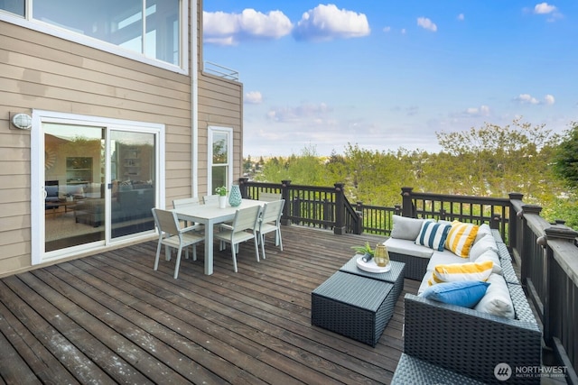 deck featuring an outdoor living space and outdoor dining area