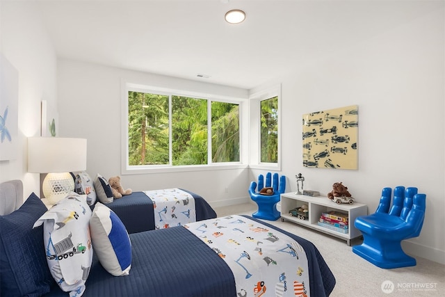 bedroom featuring baseboards, visible vents, and carpet