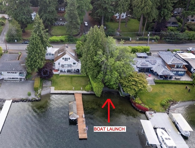 bird's eye view featuring a residential view and a water view