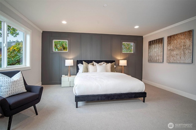 bedroom with light carpet, baseboards, recessed lighting, a decorative wall, and ornamental molding