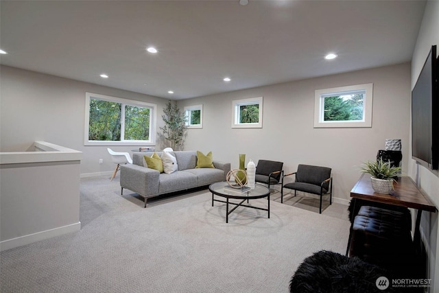 living area featuring plenty of natural light, baseboards, carpet flooring, and recessed lighting