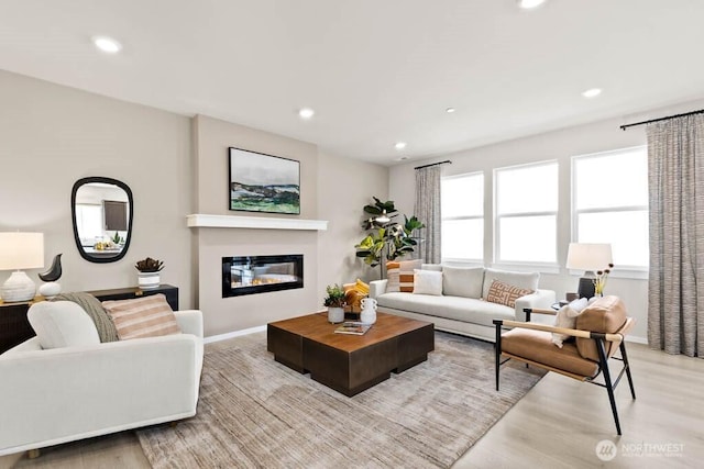 living room with baseboards and recessed lighting