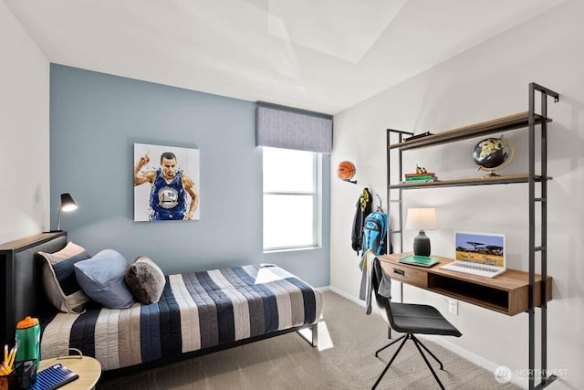 bedroom featuring carpet floors and baseboards