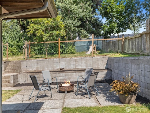 4913 W View Dr, Everett, WA 98203 - view of patio / terrace with an outdoor fire pit