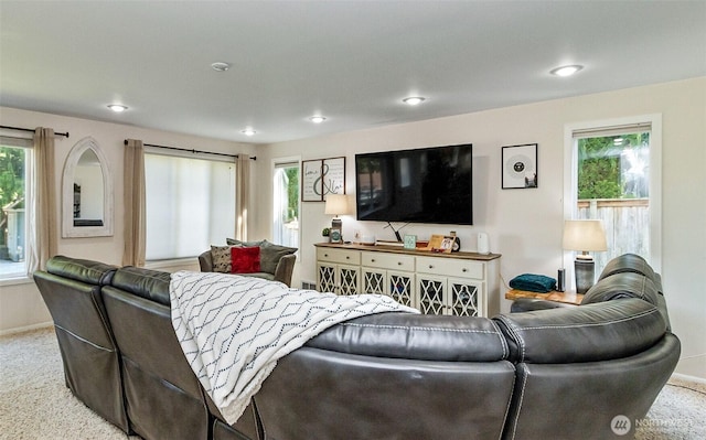 carpeted living room with a healthy amount of sunlight, recessed lighting, and baseboards