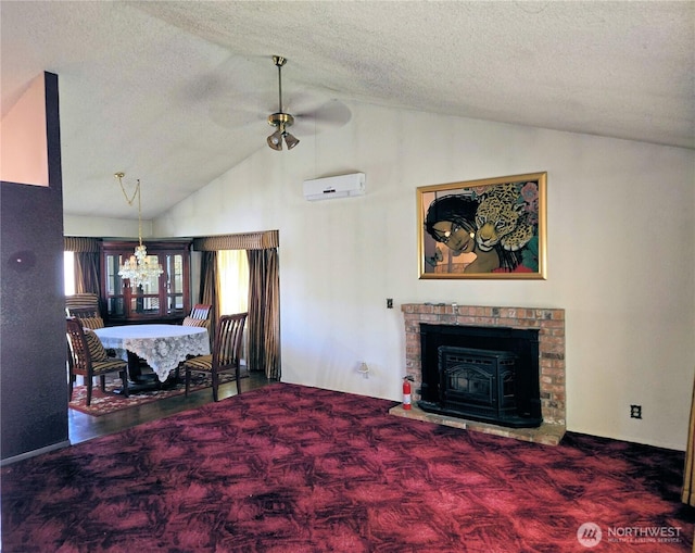 carpeted living area featuring lofted ceiling, a wall unit AC, a ceiling fan, a textured ceiling, and a chandelier