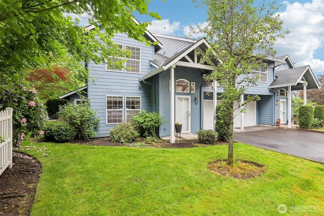 17200 SE 26th Dr Unit P56, Vancouver, WA 98683 - view of front of house with a front yard, asphalt driveway, an attached garage, and stucco siding