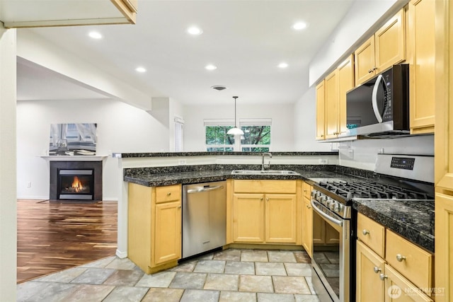 17200 SE 26th Dr Unit P56, Vancouver, WA 98683 - kitchen with appliances with stainless steel finishes, a sink, a peninsula, light brown cabinets, and recessed lighting