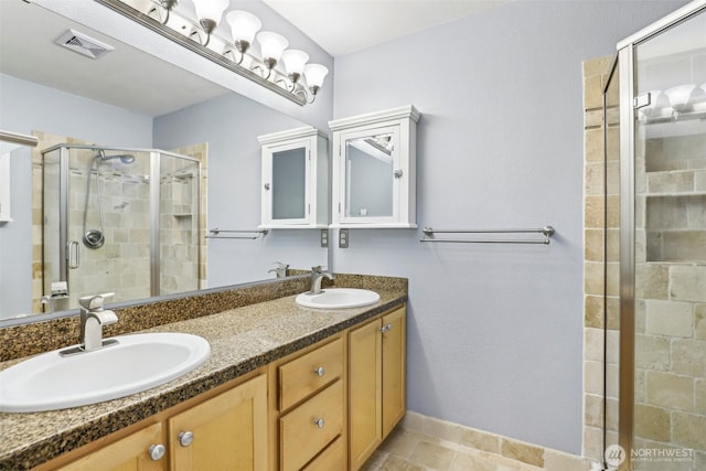 17200 SE 26th Dr Unit P56, Vancouver, WA 98683 - bathroom featuring double vanity, a stall shower, and baseboards