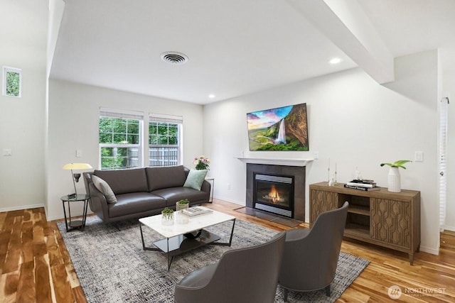 17200 SE 26th Dr Unit P56, Vancouver, WA 98683 - living room with wood finished floors, baseboards, a tiled fireplace, and recessed lighting