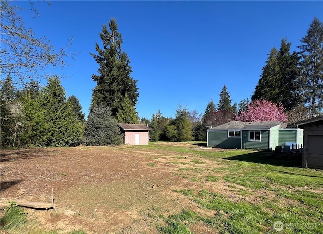 6321 Central Park Dr, Aberdeen, WA 98520 - view of yard featuring an outdoor structure and a storage shed