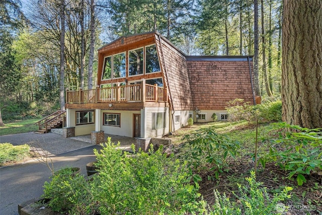 6044 Buckthorn Ct NW, Olympia, WA 98502 - back of house with a patio area, stairs, and a deck