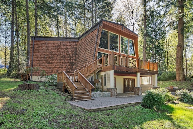 6044 Buckthorn Ct NW, Olympia, WA 98502 - back of house featuring a wooden deck, stairs, and a patio