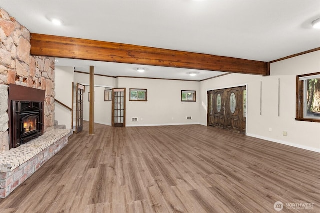 6044 Buckthorn Ct NW, Olympia, WA 98502 - unfurnished living room with wood finished floors, beamed ceiling, crown molding, baseboards, and a fireplace