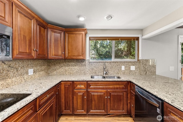 6044 Buckthorn Ct NW, Olympia, WA 98502 - kitchen featuring light stone countertops, decorative backsplash, a sink, and appliances with stainless steel finishes