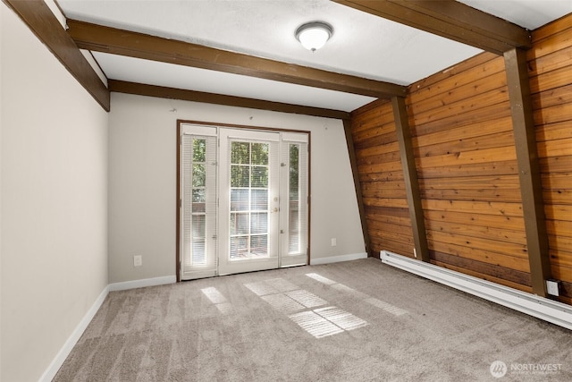 6044 Buckthorn Ct NW, Olympia, WA 98502 - spare room with beamed ceiling, baseboards, wood walls, and carpet