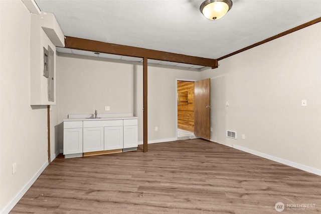 6044 Buckthorn Ct NW, Olympia, WA 98502 - interior space featuring visible vents, light wood finished floors, baseboards, and a sink