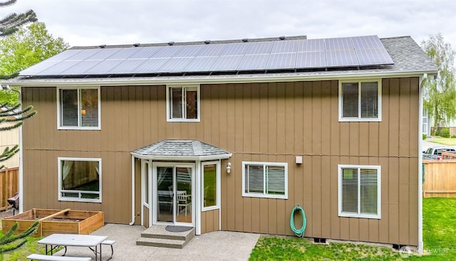 5475 Park Place Loop SE, Lacey, WA 98503 - back of property featuring roof mounted solar panels and a patio