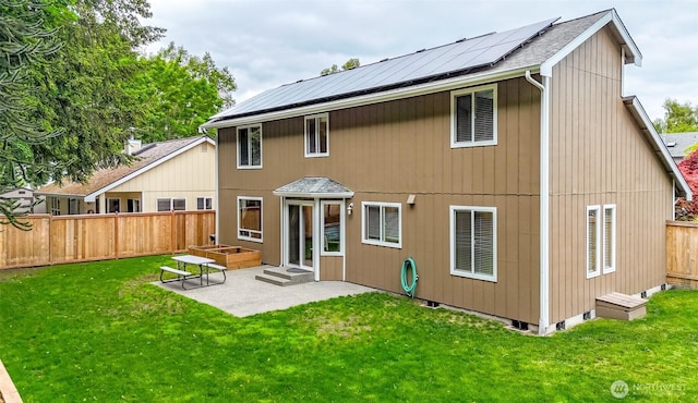 5475 Park Place Loop SE, Lacey, WA 98503 - back of property with roof mounted solar panels, a patio, and roof with shingles