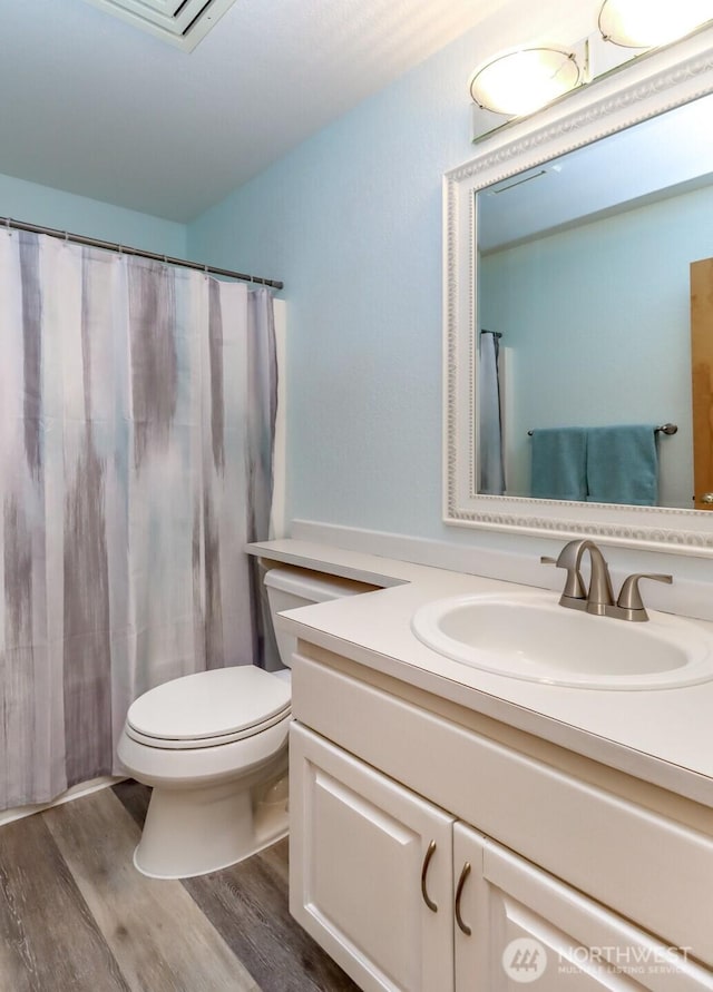 5475 Park Place Loop SE, Lacey, WA 98503 - bathroom with toilet, wood finished floors, and vanity