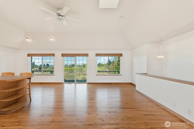 30729 76th Ave NW, Stanwood, WA 98292 - empty room with lofted ceiling, plenty of natural light, and light wood-style floors