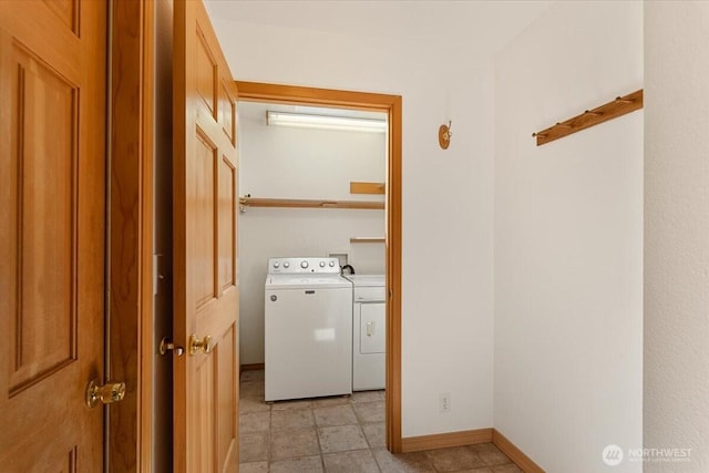 30729 76th Ave NW, Stanwood, WA 98292 - washroom featuring washing machine and dryer, baseboards, and laundry area