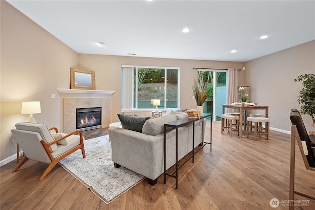 2202 NE 140th St Lot 44, Vancouver, WA 98686 - living room featuring baseboards, recessed lighting, wood finished floors, and a tiled fireplace