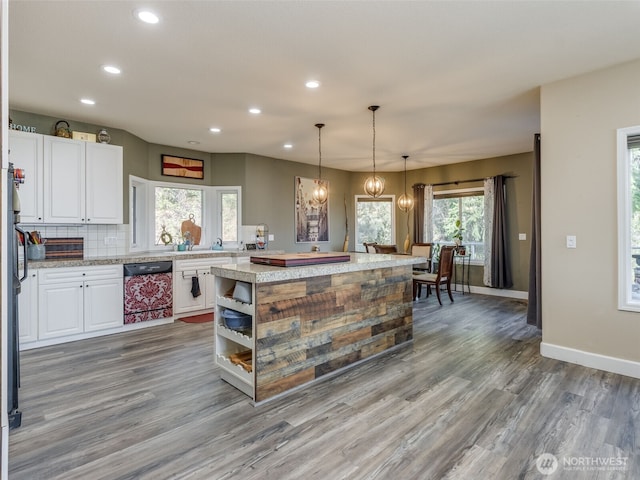 kitchen with white cabinets, recessed lighting, a chandelier, wood finished floors, and dishwasher